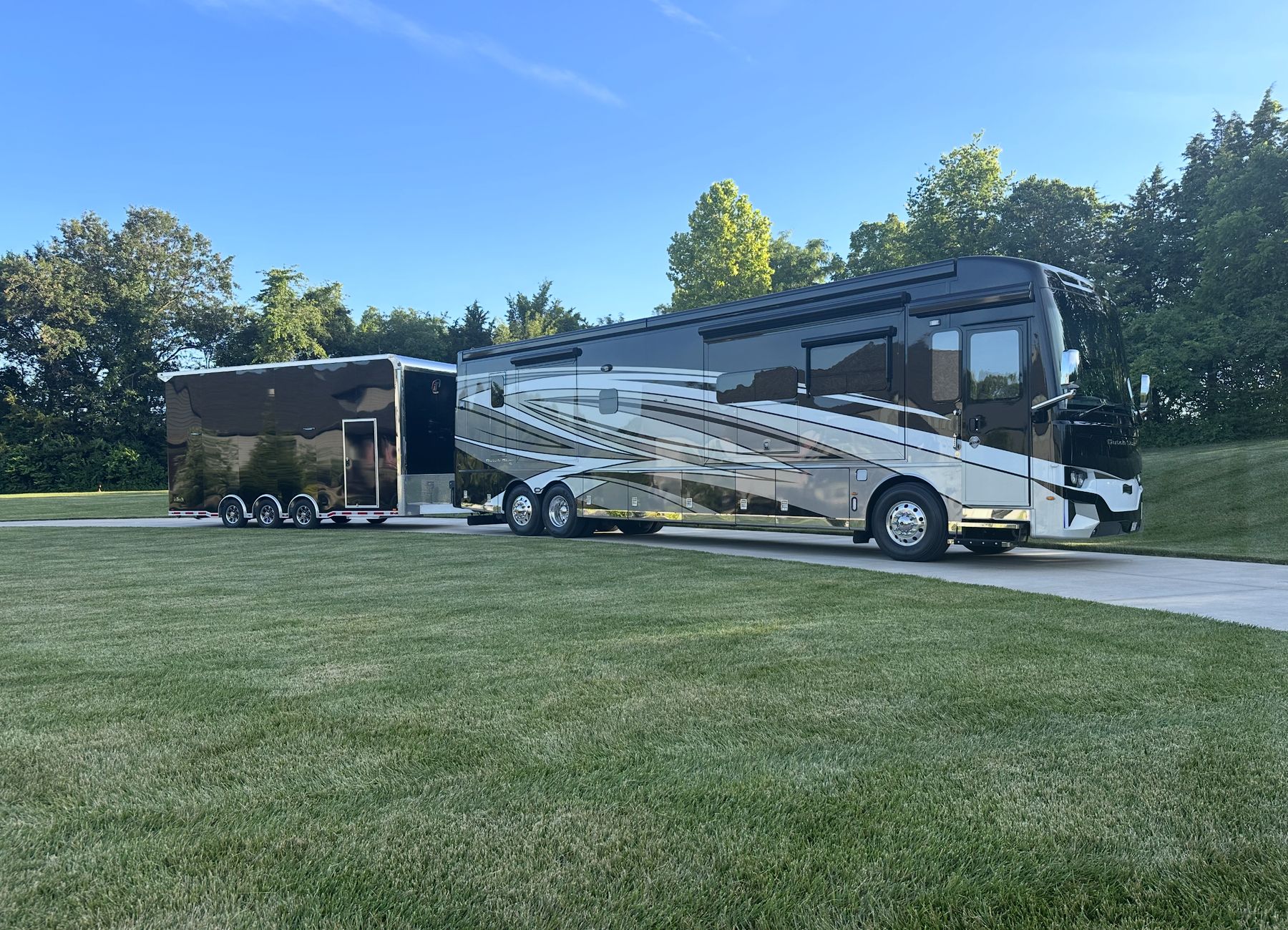 Luxury Newmar Dutch Star motorhome with an enclosed inTech stacker trailer